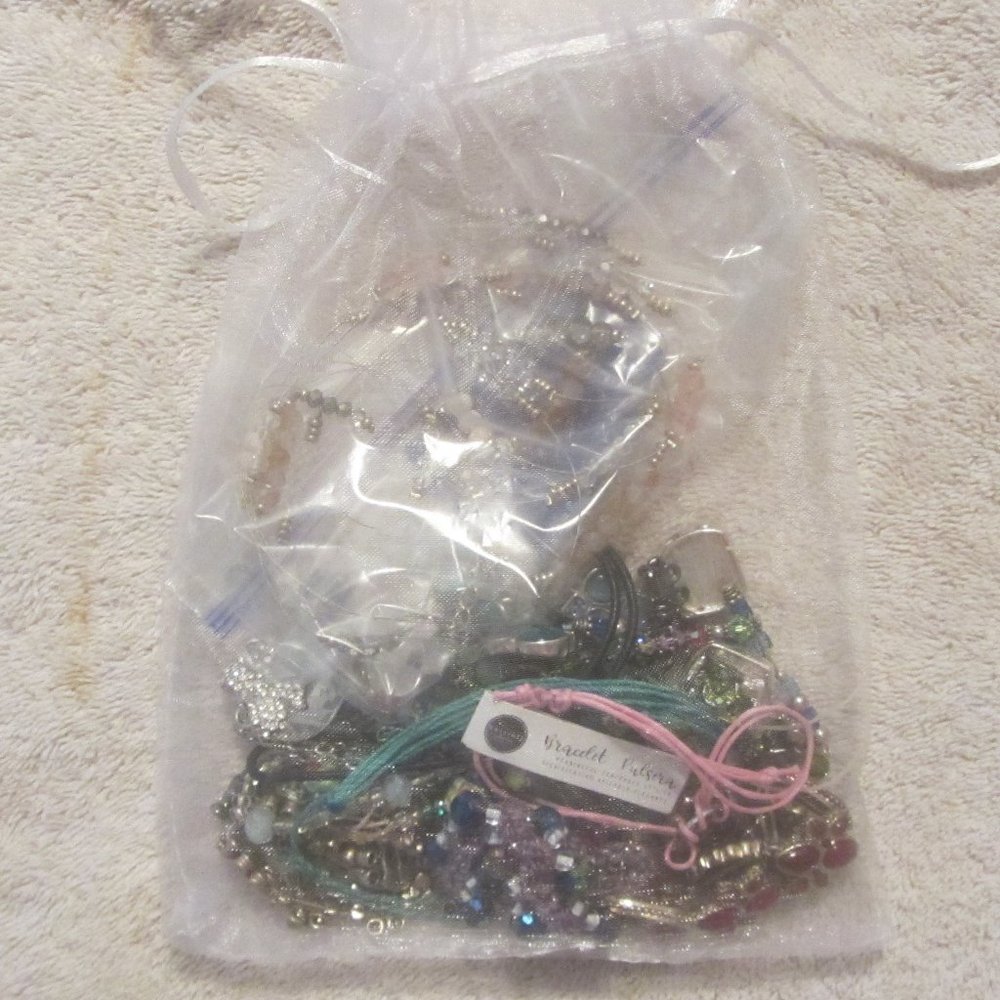 a bag of used costume jewelry some broken pieces others good